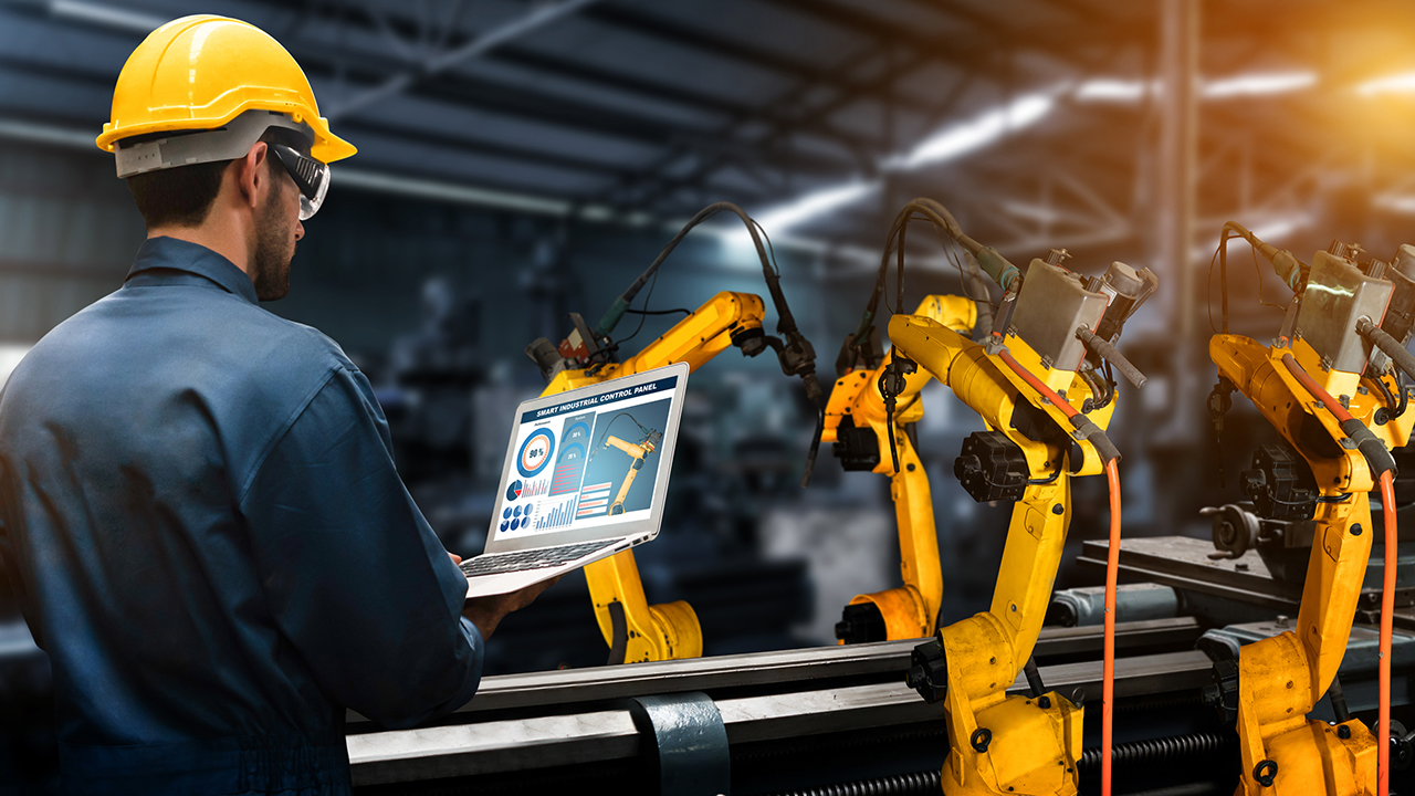 Manufacturing facility with worker on tablet
